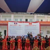 Cắt băng khánh thành 4 công trình xây dựng và cải tạo cơ sở hạ tầng giáo dục Việt Nam giúp Lào. (Nguồn: http://nhandan.com.vn)