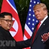 Tổng thống Mỹ Donald Trump (phải) và nhà lãnh đạo Triều Tiên Kim Jong-un. (Nguồn: AFP/TTXVN)