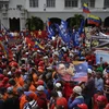Những người ủng hộ Chính phủ của Tổng thống Venezuela Nicolas Maduro tuần hành tại Caracas. (Ảnh: AFP/TTXVN)