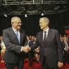 Thủ tướng Scott Morrison (trái) và lãnh đạo Công đảng đối lập Bill Shorten trong cuộc tranh luận trên truyền hình. (Ảnh: AFP/TTXVN)