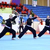 Các nữ vận động viên Việt Nam giành HCV ở môn Pencak Silat. (Ảnh: Quang Quyết/TTXVN)