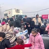 Người dân Syria trở về quê hương từ cửa khẩu Cilvegozu ở Hatay, Thổ Nhĩ Kỳ, ngày 12/12/2024. (Nguồn: THX/TTXVN) 