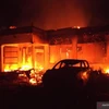 Khu vực do cảnh sát quản lý Tambelangan tại Sampang, Đông Java bị đám đông đốt cháy. (Ảnh: Antara)