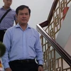 Bị cáo Nguyễn Hữu Linh rời tòa sau phiên xét xử. (Ảnh: Thành Chung/TTXVN) 