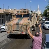 Các tay súng Syria ủng hộ Thổ Nhĩ Kỳ trong chiến dịch chống các tay súng người Kurd. (Ảnh: AFP/TTXVN)