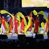 Đoàn Việt Nam biểu diễn tại lễ bế mạc SEA Games 30. (Ảnh: AFP/TTXVN) 