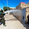 Iraq sử dụng vòi rồng chống bạo động để phun thuốc khử trùng