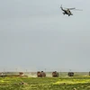 Nga và Thổ Nhĩ Kỳ tham gia cuộc tuần tra chung dưới sự yểm trợ của máy bay trực thăng. (Ảnh: AFP/TTXVN)