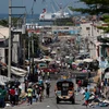 Một ngày bình thường tại thủ đô Port-au-Prince. (Ảnh: AP)