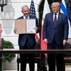 Lễ ký thỏa thuận bình thường hóa quan hệ Israel-UAE-Bahrain. (Ảnh: AFP/TTXVN)