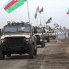 Đoàn xe quân sự Azerbaijan di chuyển vào khu vực Aghdam thuộc Nagorny-Karabakh. (Ảnh: AFP/TTXVN)