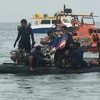 Lực lượng cứu hộ tìm kiếm máy bay gặp nạn của hãng hàng không Sriwijaya Air. (Ảnh: THX/TTXVN)