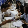 Các doanh nghiệp nghe tư vấn về nộp thuế tại Cục thuế Thành phố Hồ Chí Minh. (Nguồn: Hoàng Hải/Vietnam+)