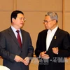 Bộ trưởng Bộ Công Thương Vũ Huy Hoàng (trái) (Ảnh: Lê Hải - PV TTXVN tại Siangpore)