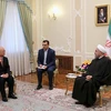 Tổng Giám đốc IAEA Yukiya Amano (trái) trong cuộc gặp Tổng thống Iran Hassan Rouhani tại Tehran ngày 20/9. (Ảnh: AFP/TTXVN)