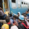 Người di cư tìm cách lên tàu để đi tới các quốc gia châu Âu. (Nguồn: greenleft.org.au)
