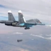 Máy bay chiến đấu Su-34 của Nga thả bom oanh tạc các mục tiêu IS tại Syria. (Ảnh: Reuters/TTXVN)
