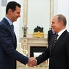 Tổng thống Nga Vladimir Putin và Tổng thống Syria Bashar al-Assad tại cuộc gặp ở Moskva. (Ảnh: AFP/TTXVN)