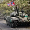 Xe tăng của lực lượng ly khai rời thị trấn Novoazovsk ở khu vực Donetsk ngày 21/10. (Ảnh: AFP/TTXVN)