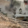 Xe tăng của quân đội Syria tham gia chiến dịch tấn công tại Harasta ngày 22/10. (Ảnh: AP)