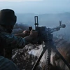 Binh sỹ chính phủ Syria chiến đấu tại tỉnh Latakia. (Ảnh: AP)
