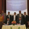 Lễ ký kết Dự án hỗ trợ kỹ thuật xây dựng chiến lược ứng phó với biến đổi khí hậu giữa thành phố Đà Nẵng và AFD. (Ảnh: TTXVN)
