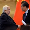Ngoại trưởng Trung Quốc Vương Nghị và người đồng cấp Syria Walid Muallem đang ở thăm Bắc Kinh. (Ảnh: AFP/TTXVN)