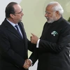 Thủ tướng Ấn Độ Narendra Modi (phải) và Tổng thống Pháp Francois Hollande trong chuyến thăm Ấn Độ. (Nguồn: ibtimes.com)