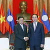 Chủ tịch nước Trần Đại Quang tiếp Thủ tướng Chính phủ Lào Thongloun Sisoulith đang thăm hữu nghị chính thức Việt Nam. (Ảnh: Nhan Sáng-TTXVN)