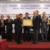 Bí thư Thành ủy Đinh La Thăng và Ngoại trưởng Mỹ John Kerry dự lễ công bố thành lập Đại học Fulbright. (Ảnh: Thanh Vũ/TTXVN)