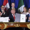 (Từ trái sang): Ông Enrique Pena Nieto (khi đang đương chức Tổng thống Mexico), Tổng thống Mỹ Donald Trump và Thủ tướng Canada Justin Trudeau ký Hiệp định thương mại Mỹ-Mexico-Canada (USMCA) tại Buenos Aires, Argentina ngày 30/11/2018. (Ảnh: AFP/TTXVN)