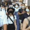 Người dân đeo khẩu trang phòng lây nhiễm COVID-19 khi di chuyển trên đường phố tại Tokyo, Nhật Bản, ngày 20/8/2020. (Ảnh: THX/TTXVN)
