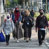 Người dân đeo khẩu trang phòng lây nhiễm COVID-19 tại Jakarta, Indonesia, ngày 19/8/2020. (Ảnh: THX/ TTXVN)