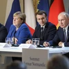 (Từ trái qua phải) Tổng thống Ukraine Volodymyr Zelenskiy, Thủ tướng Đức Angela Merkel, Tổng thống Pháp Emmanuel Macron và Tổng thống Nga Vladimir Putin tại cuộc họp báo ở Paris ngày 9/12/2019. (Ảnh: AFP/TTXVN)