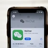 Biểu tượng WeChat trên một màn hình điện thoại ở Washington, DC, Mỹ. (Ảnh: AFP/TTXVN)