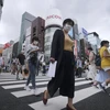Người dân đeo khẩu trang phòng lây nhiễm COVID-19 tại Tokyo, Nhật Bản. (Ảnh: AFP/TTXVN)