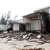 Một ngôi nhà bị hư hỏng bởi cơn bão số 13 tại phường Cẩm An, Hội An, tỉnh Quảng Nam. (Ảnh: Trịnh Bang Nhiệm/TTXVN)