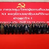 Ban chấp hành Trung ương khóa XI Đảng NDCM Lào chụp ảnh chung. Ảnh do Ban Tổ chức cấp. (Ảnh: TTXVN)