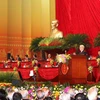 Tổng Bí thư, Chủ tịch nước Nguyễn Phú Trọng đọc Báo cáo chính trị của Ban Chấp hành Trung ương Đảng khóa XII và các văn kiện trình Đại hội. (Ảnh: TTXVN)