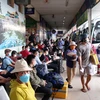 [Photo] Người dân đổ về các bến xe, nhà ga rời TP.HCM về quê đón Tết