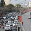 [Photo] Người dân đổ về quê đón Tết, cửa ngõ Thủ đô ùn tắc kéo dài