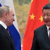 Chủ tịch Trung Quốc Tập Cận Bình (phải) và Tổng thống Nga Vladimir Putin tại cuộc gặp ở Bắc Kinh (Trung Quốc), ngày 4/2/2022. (Ảnh: AFP/TTXVN)