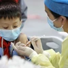 Tiêm vaccine phòng COVID-19 cho người dân tại tỉnh Phúc Kiến, Trung Quốc. (Ảnh: AFP/TTXVN)
