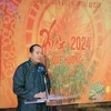 Đại sứ Nguyễn Huy Dũng phát biểu khai mạc chương trình Tết Cộng đồng, chào đón Xuân Giáp Thìn 2024. (Ảnh: Nguyễn Trường/TTXVN)