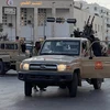 Các thành viên Chính phủ Thống nhất quốc gia Libya (GNU) sau cuộc giao tranh với các nhóm vũ trang đối địch. (Ảnh: THX/TTXVN)