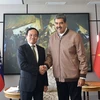 Tổng thống Venezuela Nicolás Maduro chào mừng Phó Thủ tướng Trần Lưu Quang tới thăm Venezuela. (Ảnh: VGP/ TTXVN phát)
