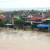 Quảng Bình lại chìm trong mưa lũ, nhiều nhà bị ngập sâu. (Ảnh: Đức Thọ/TTXVN)