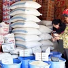 Ảnh minh họa: Cửa hàng bán gạo bình ổn giá của Công ty Lương thực Hồ Chí Minh tại huyện Bình Chánh. (Nguồn: Đình Huệ/TTXVN)