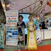 Hình ảnh tà áo dài Việt Nam luôn xuất hiện tại hội chợ VITM Hanoi 2019. (Ảnh: M.Mai/Vietnam+)