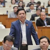 Bộ trưởng Nguyễn Văn Thể trên nghị trường kỳ họp thứ 10, Quốc hội khóa XIV. (Ảnh: quochoi.vn)
